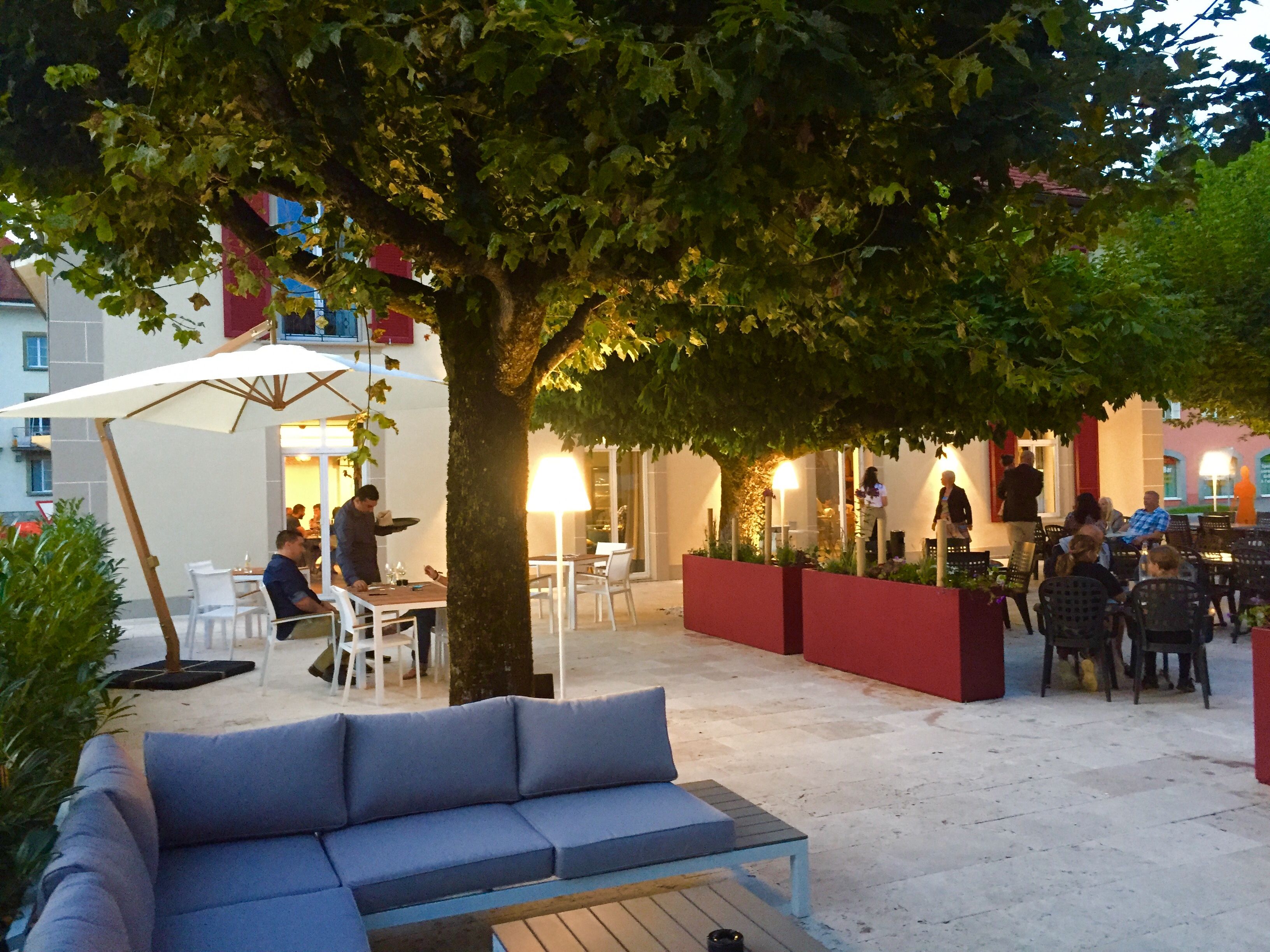 Summer lounge area on the terrace at the Hôtel La Belle Croix in Romont